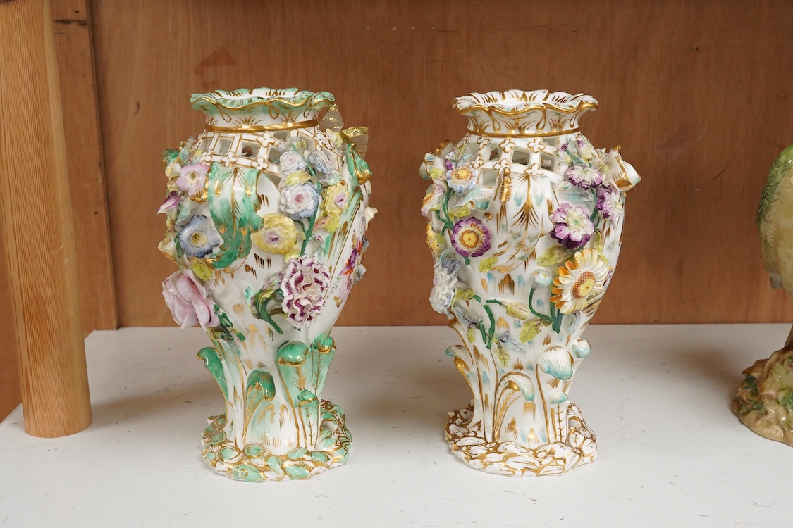 A near pair of English porcelain flower encrusted vases, c.1830, possibly Coalbrookdale, 21cm high